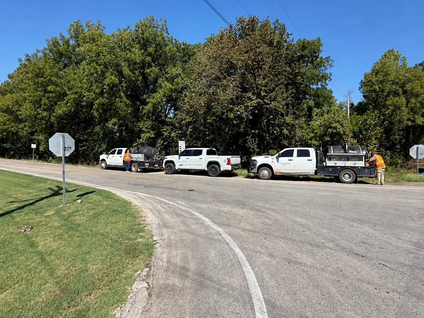 Shuterra’s crew with its pickup and flatbed application trucks fitted with tanks and spray equipment